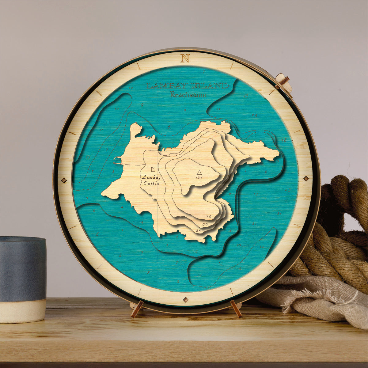Wooden map model of Lambay Island on a stand with a green background