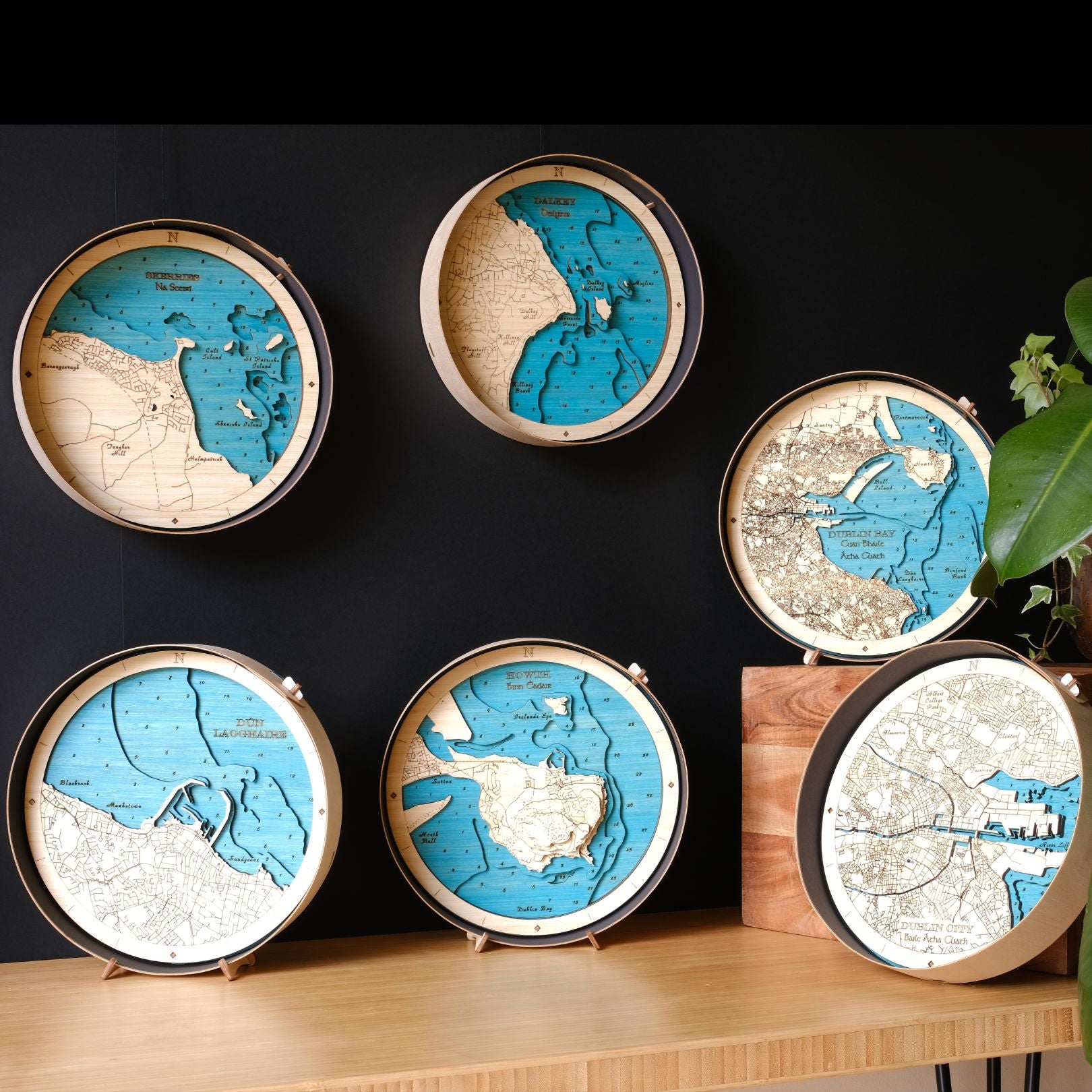 Dublin collection of 6 round wooden maps on a bench and wall behind