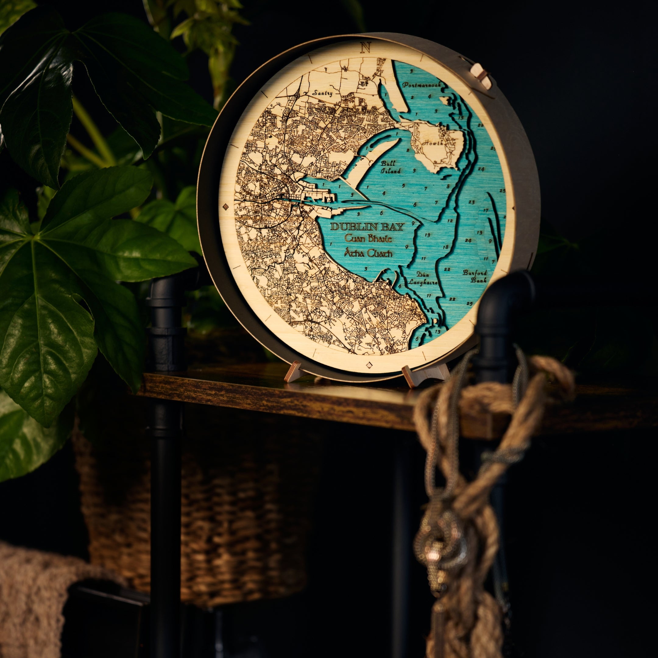 Dublin Bay round wooden 3d map on table in dark setting